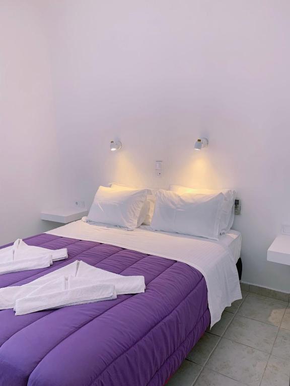 Postel nebo postele na pokoji v ubytování Alkyon Hotel