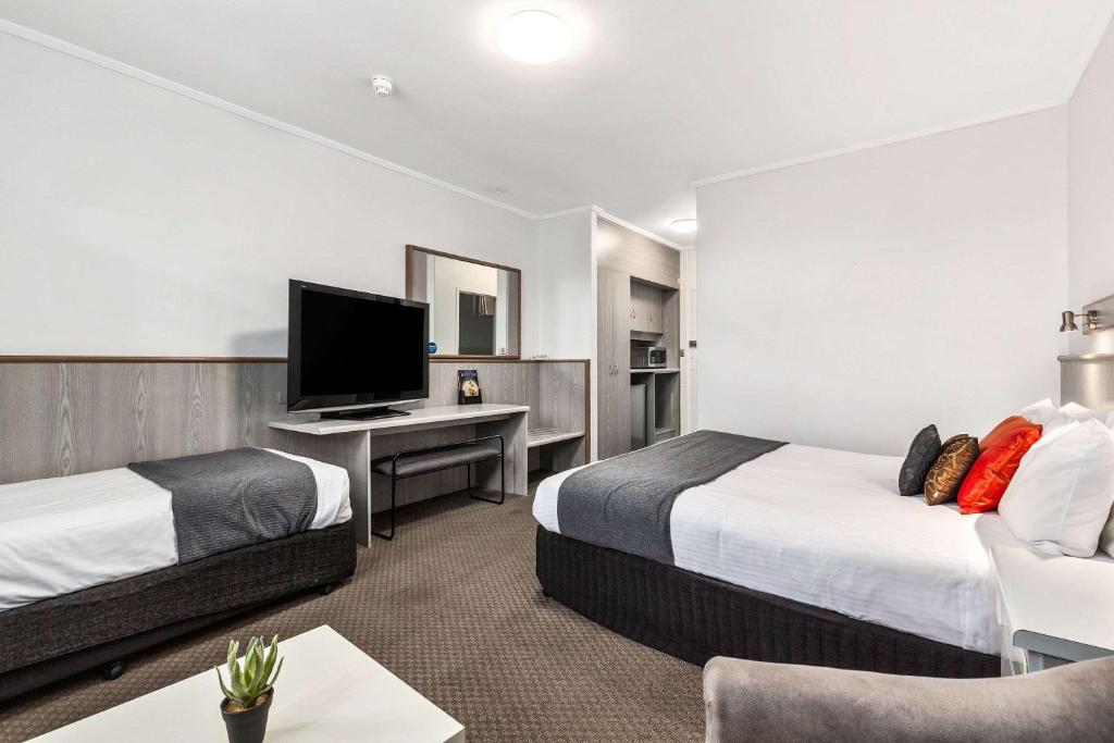 Postel nebo postele na pokoji v ubytování Comfort Inn Glenelg