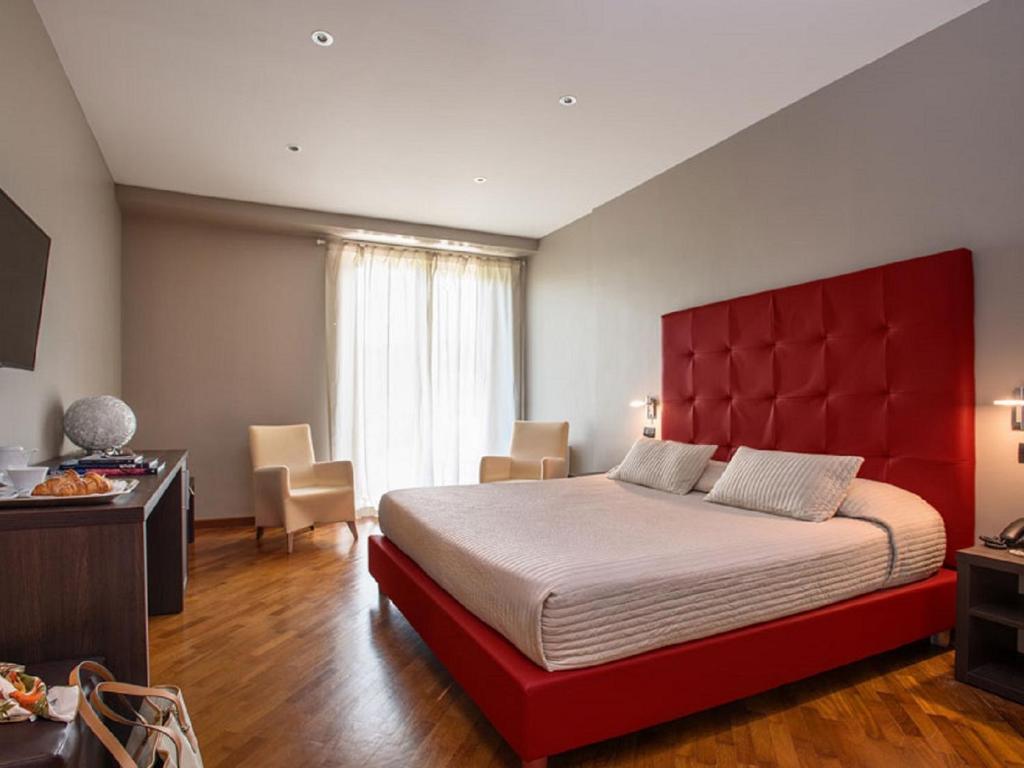Postel nebo postele na pokoji v ubytování Hotel San Giorgio