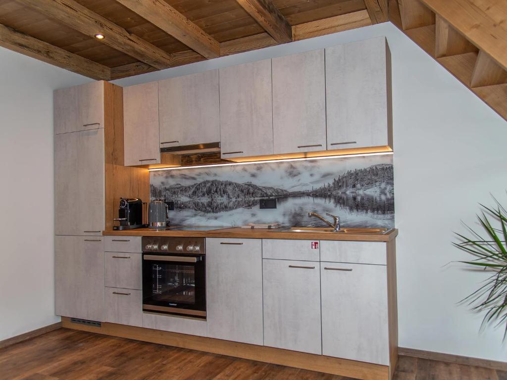 Kuchyň nebo kuchyňský kout v ubytování Gasthof Appartements Gamskar