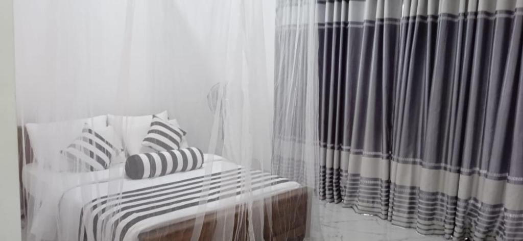 Postel nebo postele na pokoji v ubytování Baagie Homestay