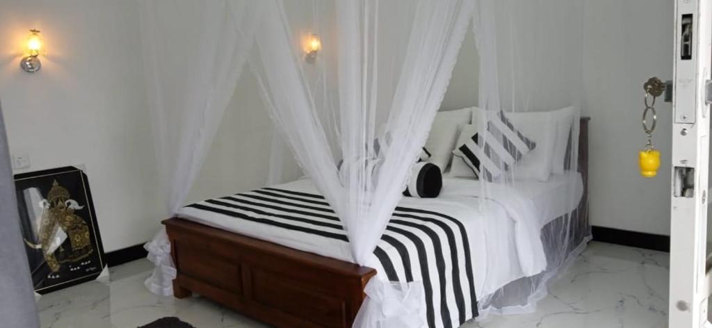 Postel nebo postele na pokoji v ubytování Baagie Homestay