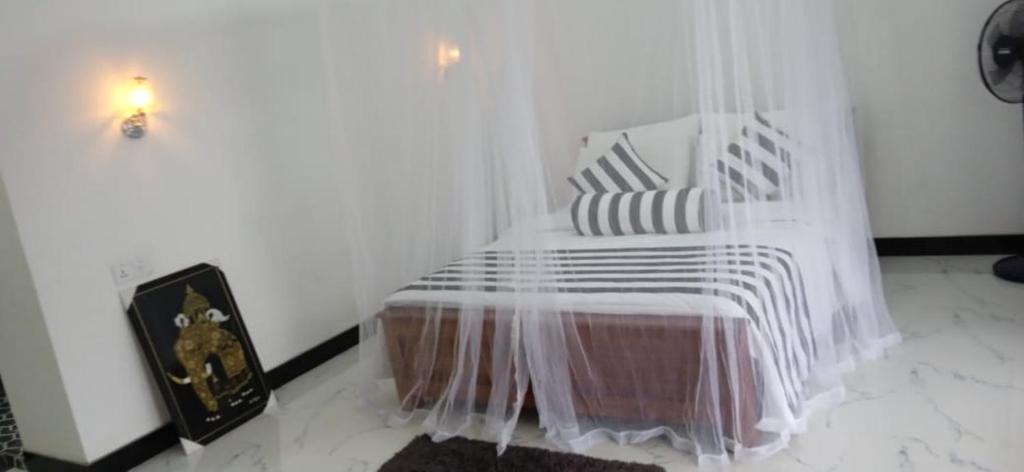 Postel nebo postele na pokoji v ubytování Baagie Homestay