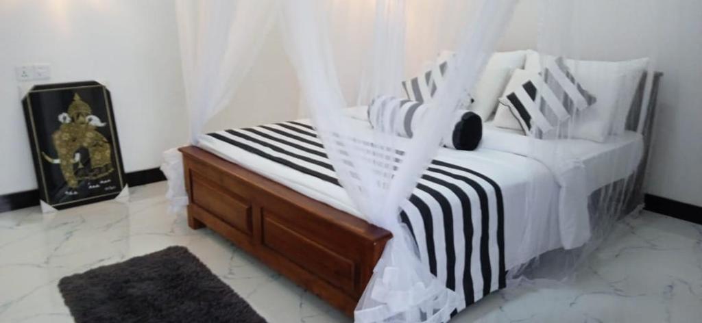 Postel nebo postele na pokoji v ubytování Baagie Homestay