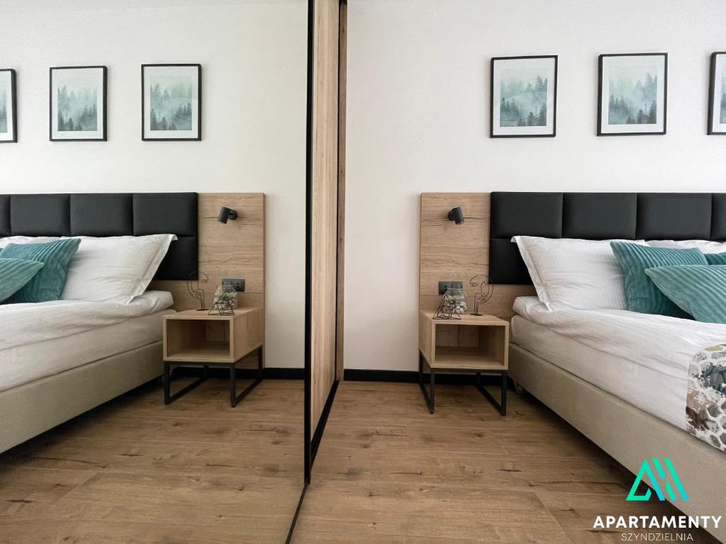 Ein Bett oder Betten in einem Zimmer der Unterkunft APARTAMENTY SZYNDZIELNIA RODZINNE - 2 SYPIALNIE & BALKON & GÓRY & Parking - TWOJA BAZA WYPADOWA NA SZLAKI i W GÓRY - FAMILY SPACE & BASE