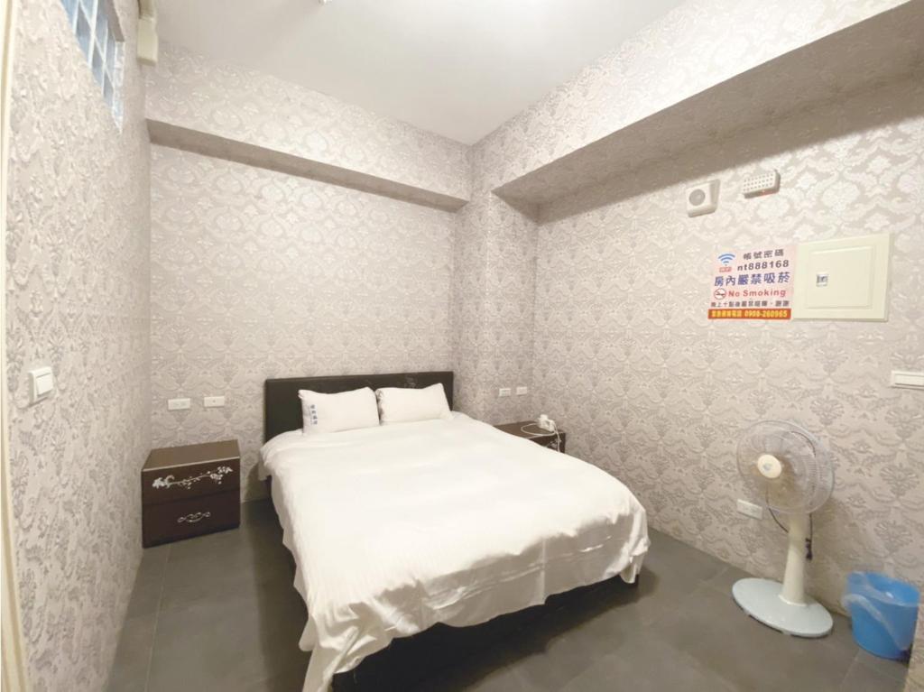 Postel nebo postele na pokoji v ubytování Yixiang Spring Travel