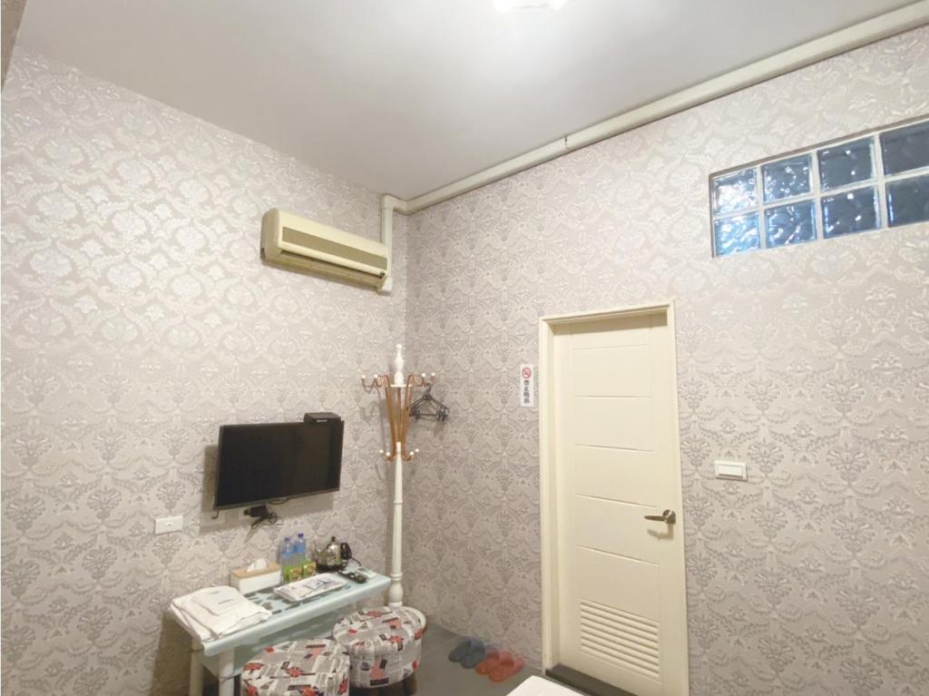 TV a/nebo společenská místnost v ubytování Yixiang Spring Travel
