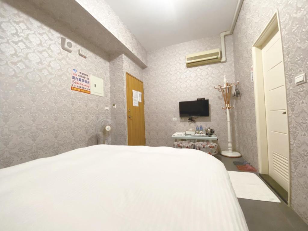 Postel nebo postele na pokoji v ubytování Yixiang Spring Travel