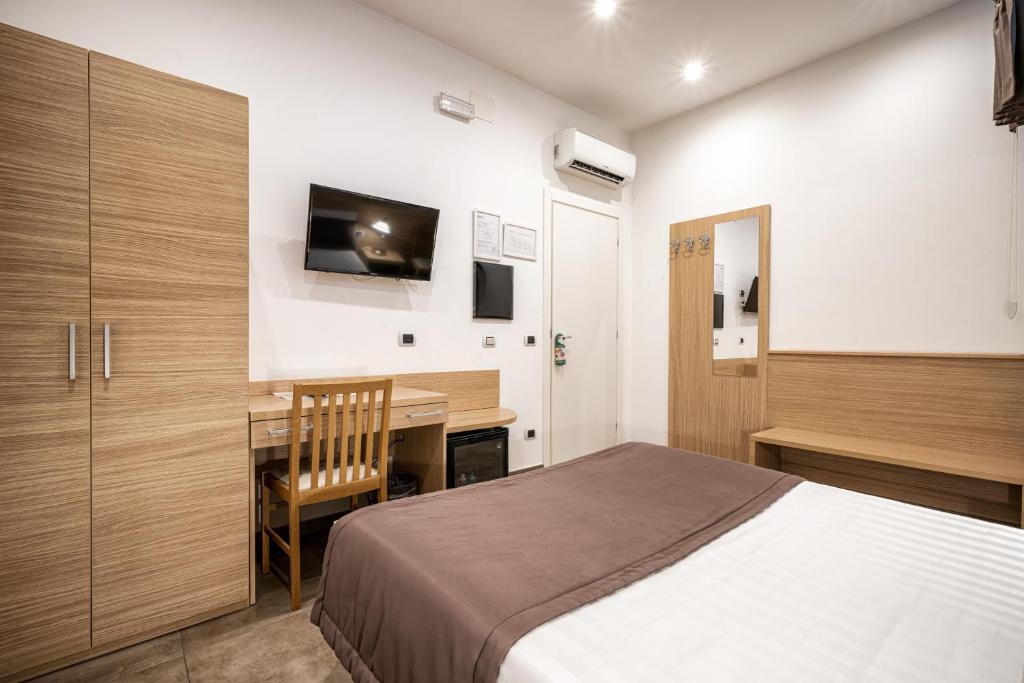 Una cama o camas en una habitación de Hotel Paolo II