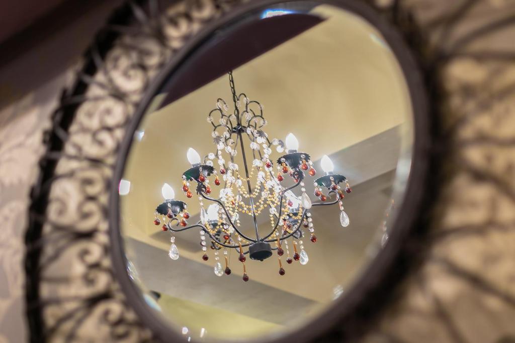 a reflection of a chandelier in a mirror at Skegness The Royal Hotel in Skegness