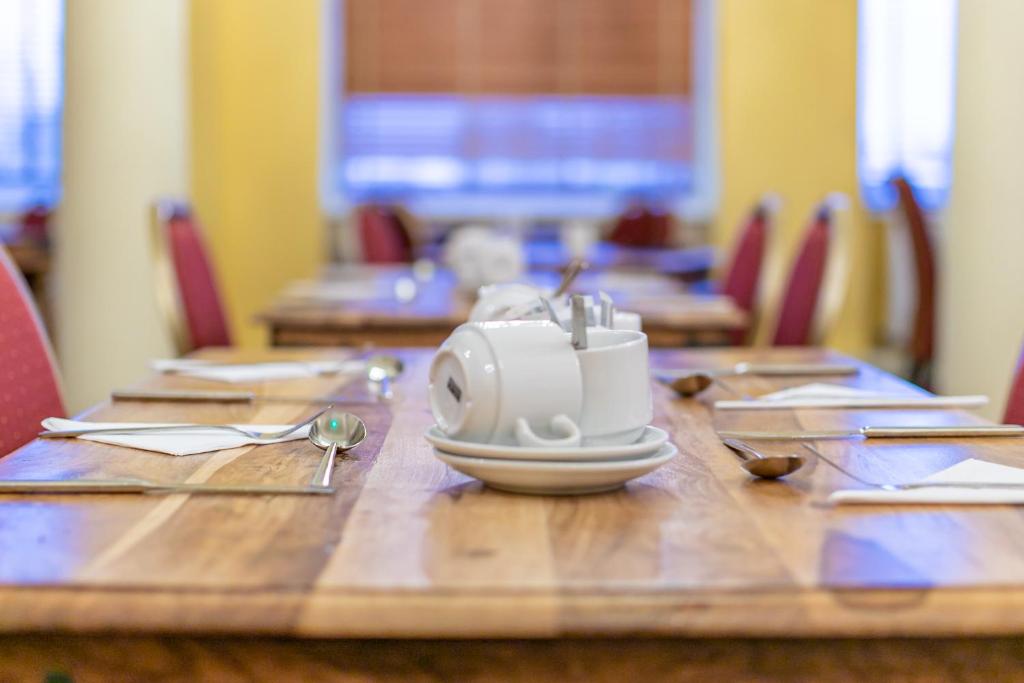 a table with a toaster sitting on top of it at Skegness The Royal Hotel in Skegness