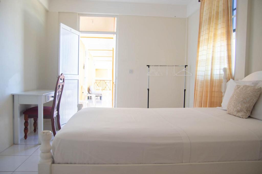Postel nebo postele na pokoji v ubytování St. James Guesthouse