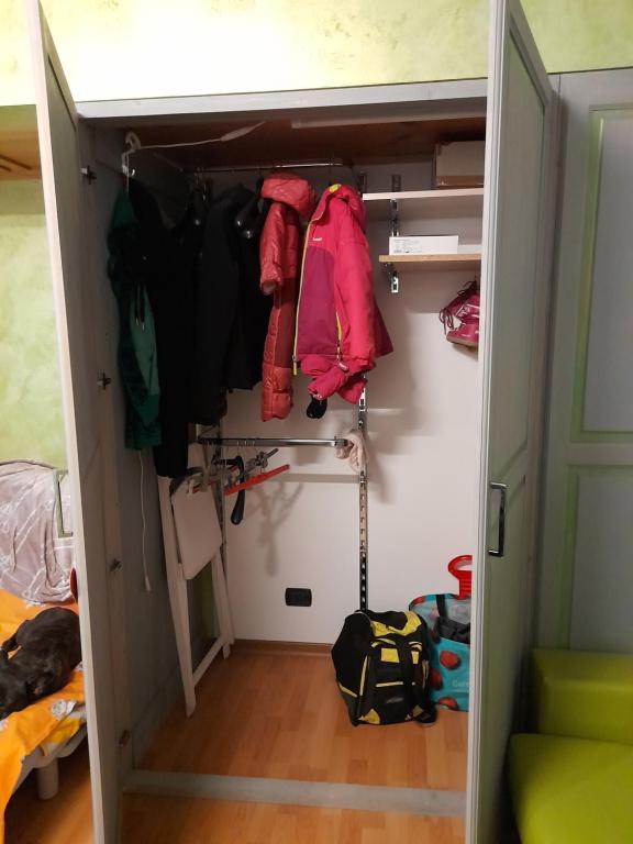 a walk in closet with a door open at SESTRIERE Fronte Piste in Sestriere