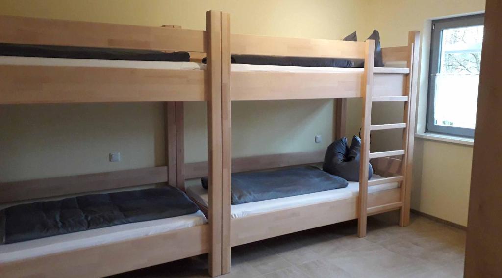 Postel nebo postele na pokoji v ubytování Pension Freizeitzentrum Sambachshof