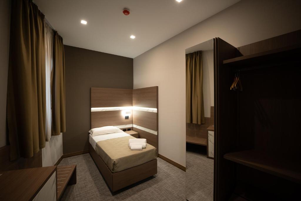 Postel nebo postele na pokoji v ubytování Building Hotel