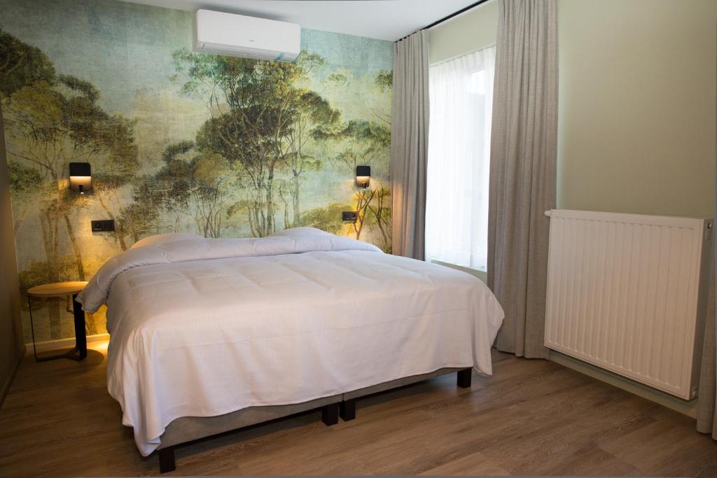 Postel nebo postele na pokoji v ubytování Appart hôtel En Ville