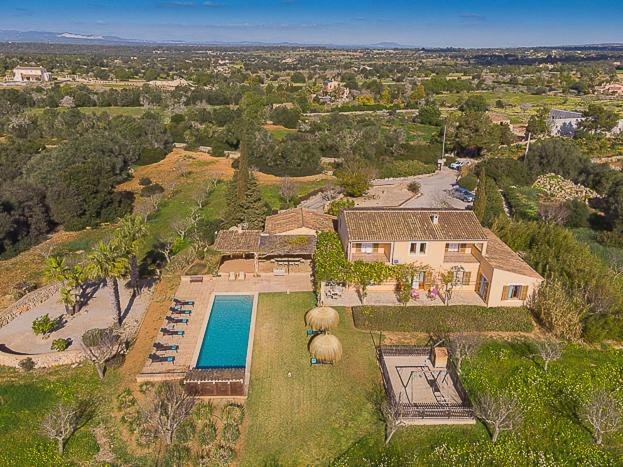 an aerial view of a house with a swimming pool at Finca Parra in Santanyi