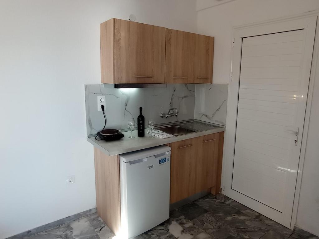 Kuchyň nebo kuchyňský kout v ubytování Fengeros Village
