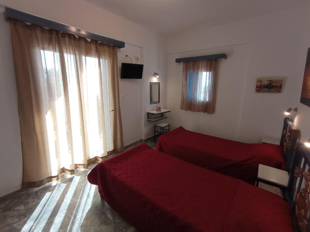 Postel nebo postele na pokoji v ubytování Fengeros Village