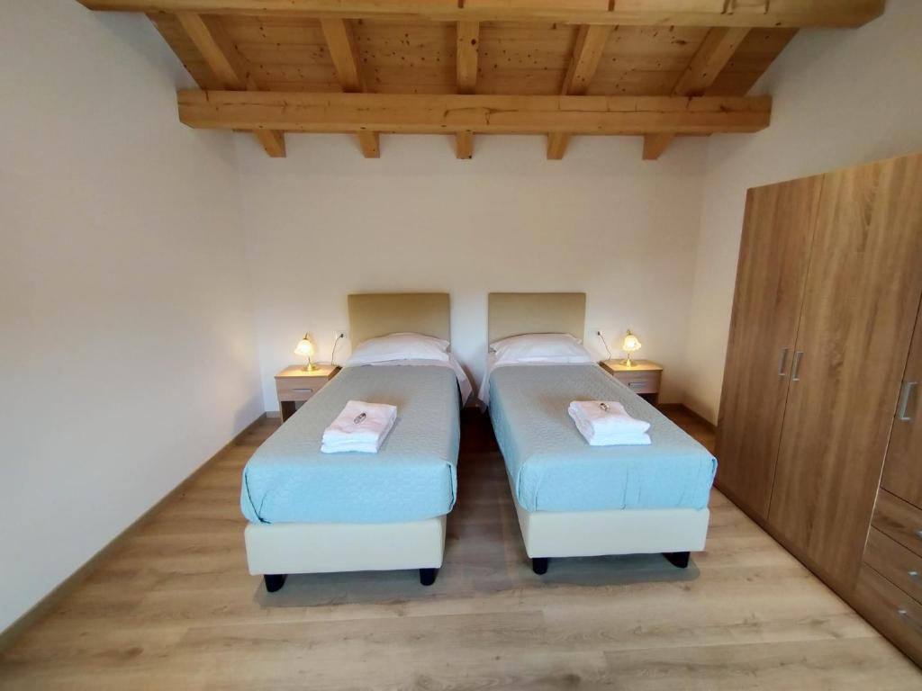 Postel nebo postele na pokoji v ubytování Antico Melo B&B
