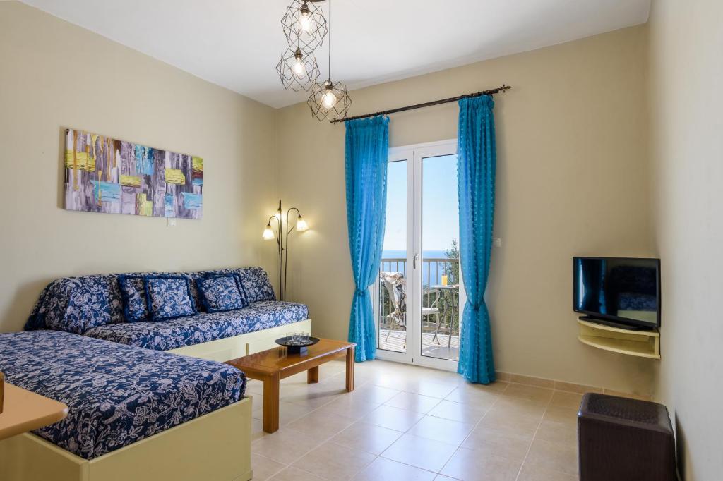 Telewizja i/lub zestaw kina domowego w obiekcie Nikos & Vassilis apartments Kefalonia