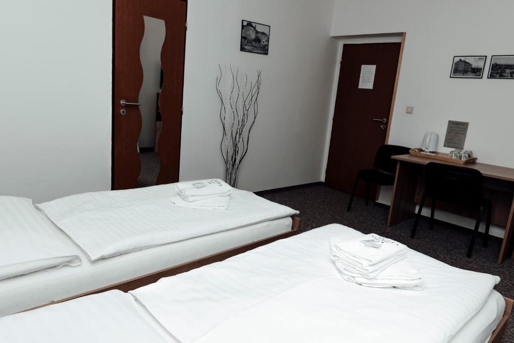Posteľ alebo postele v izbe v ubytovaní PENZION VERMON