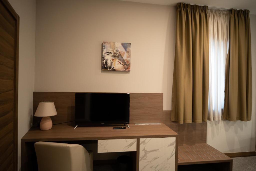 TV a/nebo společenská místnost v ubytování Building Hotel