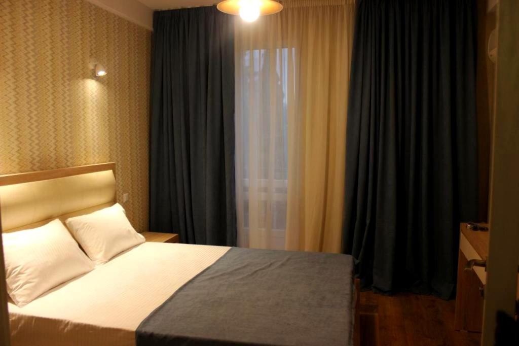 Postel nebo postele na pokoji v ubytování Hotel Lile