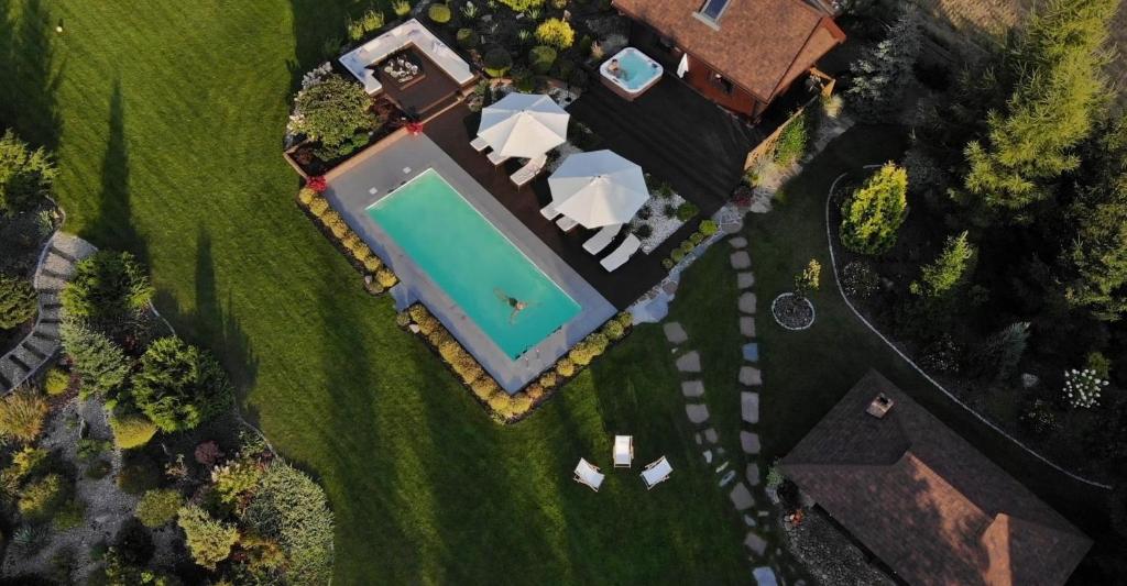 an overhead view of a house with a swimming pool at Anahata Siedlisko&Spa in Sejny