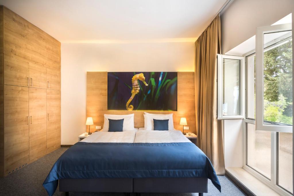 Postel nebo postele na pokoji v ubytování Remisens Hotel Epidaurus-All inclusive