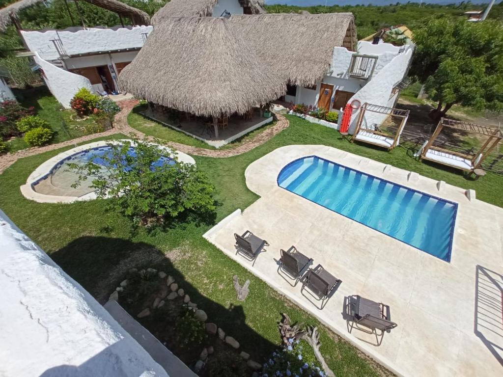 an aerial view of a house with a swimming pool at Casa Dibulla Hotel Boutique in Dibulla