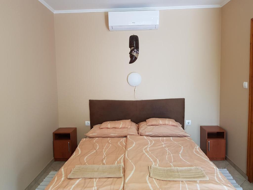 Postel nebo postele na pokoji v ubytování Muskátli Apartman