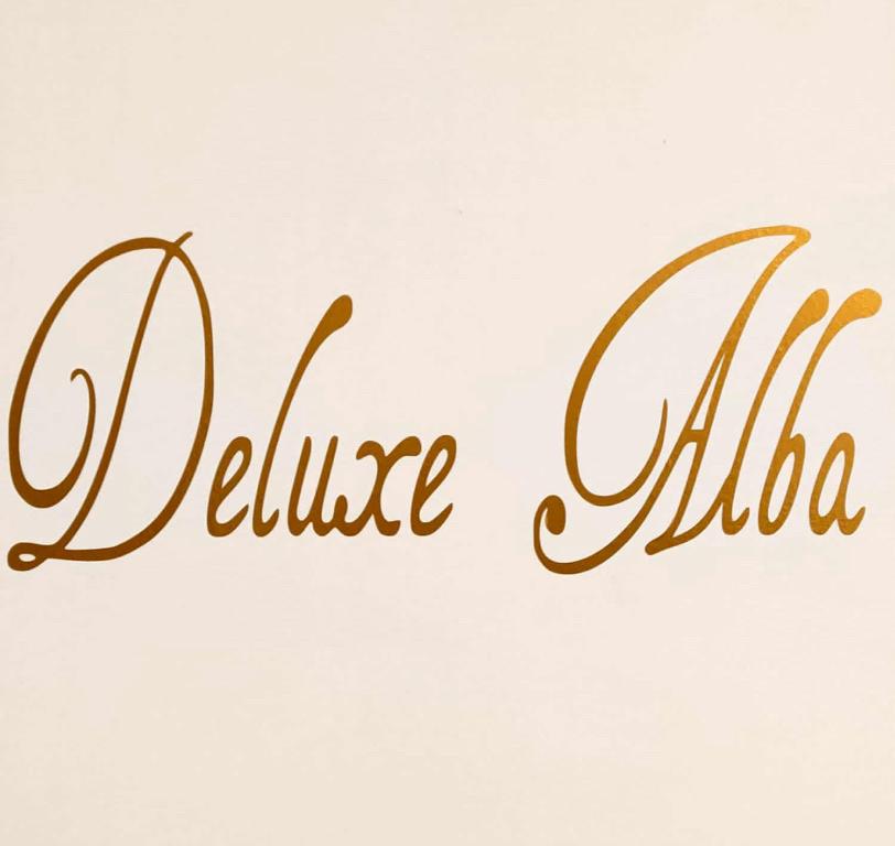 Un certificado, premio, letrero u otro documento en Deluxe Alba