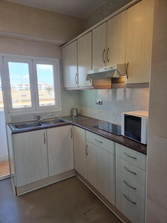 A kitchen or kitchenette at Appartement Cala Blanca