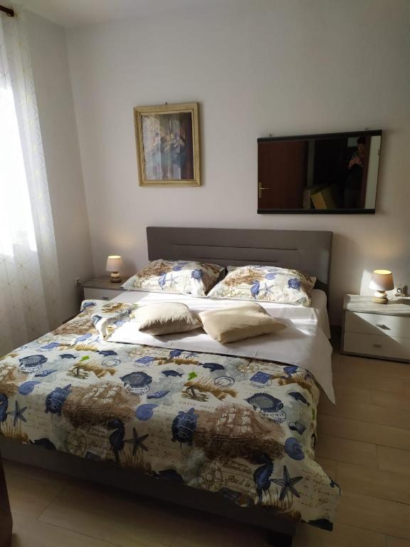Łóżko lub łóżka w pokoju w obiekcie Apartments Spada