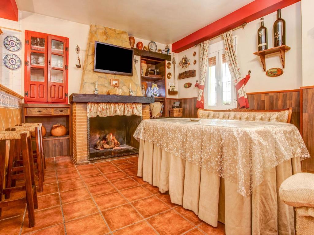 Televízia a/alebo spoločenská miestnosť v ubytovaní Belvilla by OYO Cortijo Rural Puerto Nuevo