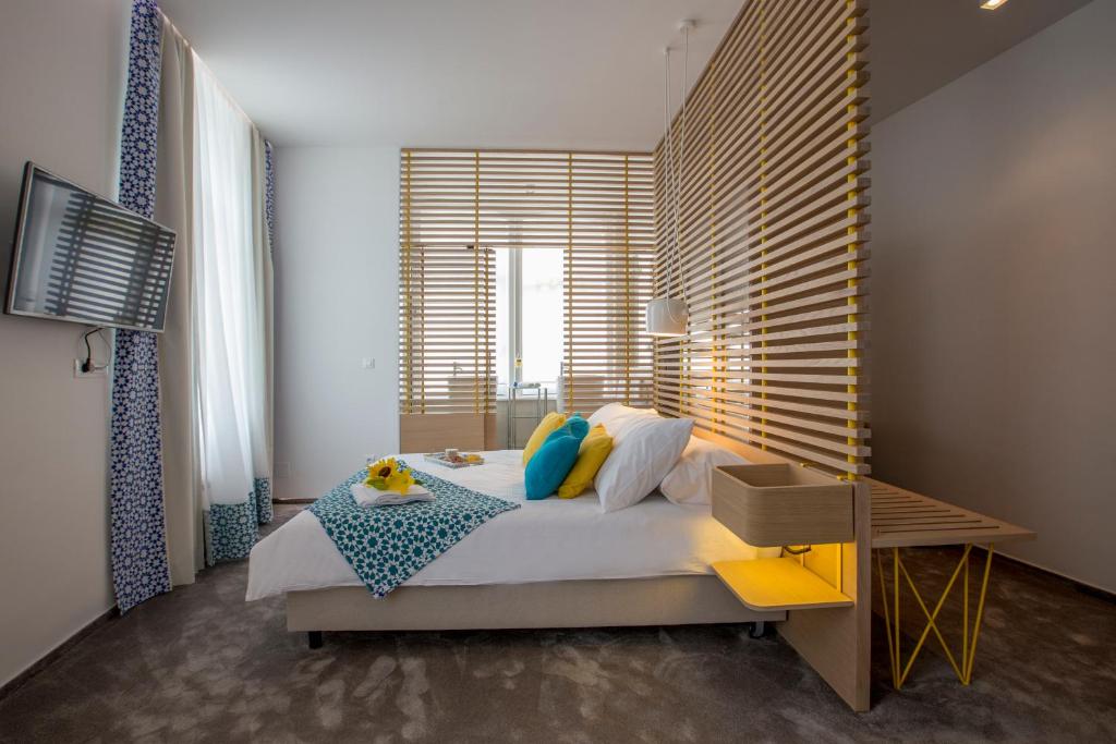 Postel nebo postele na pokoji v ubytování Bed & Atmosphere Rooms