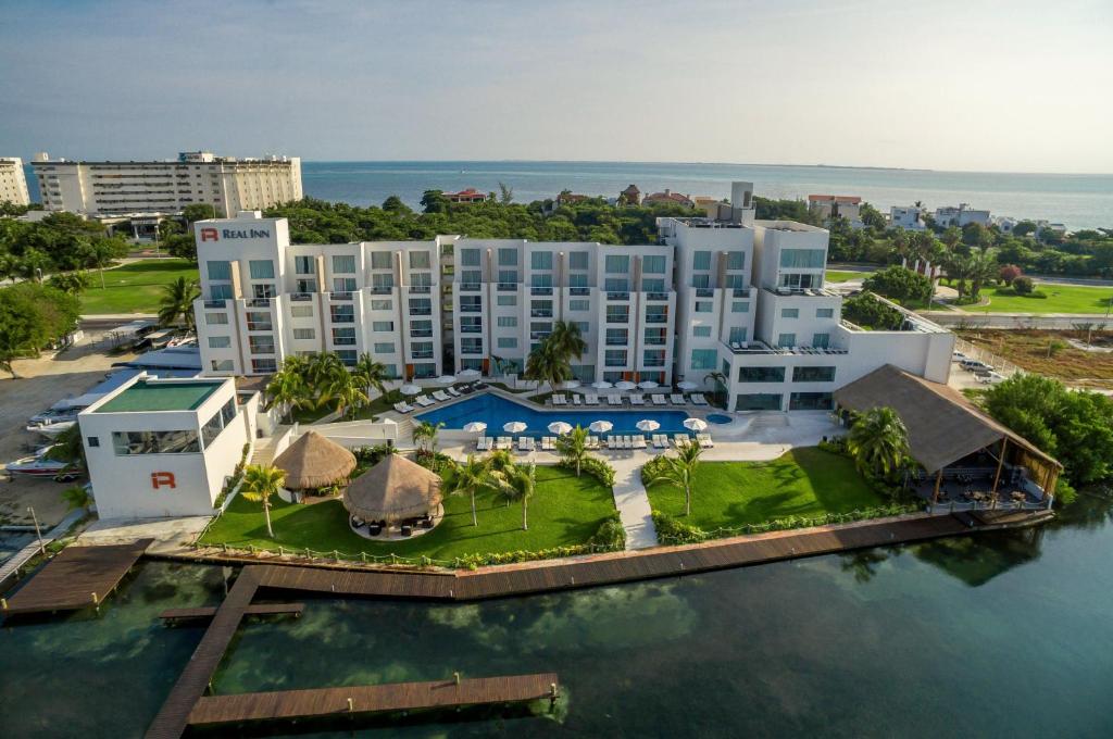 an aerial view of a resort on the water at Real Inn Cancún in Cancún