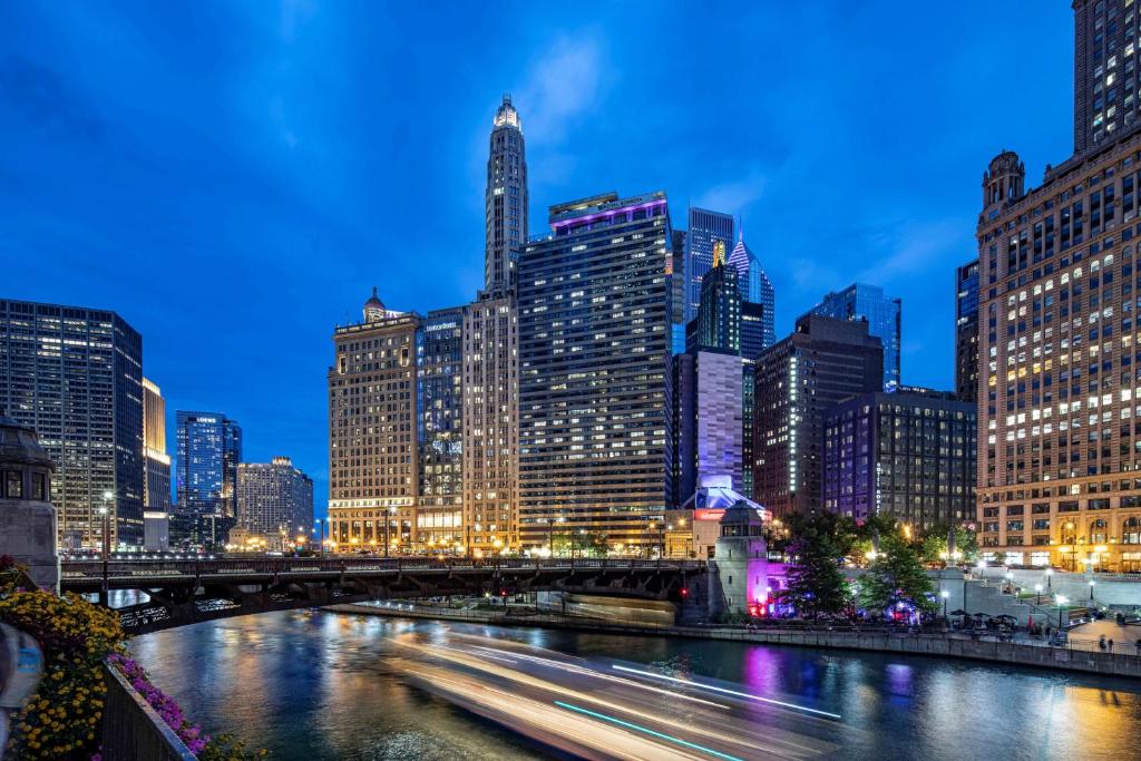 a city skyline at night with a river and buildings at The Royal Sonesta Chicago Downtown in Chicago