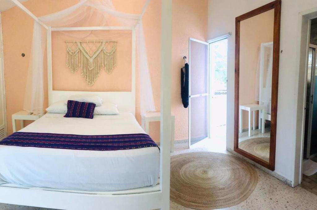 Postel nebo postele na pokoji v ubytování Hotel Downtown Merida