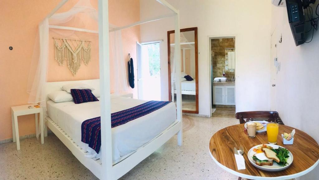 Postel nebo postele na pokoji v ubytování Hotel Downtown Merida