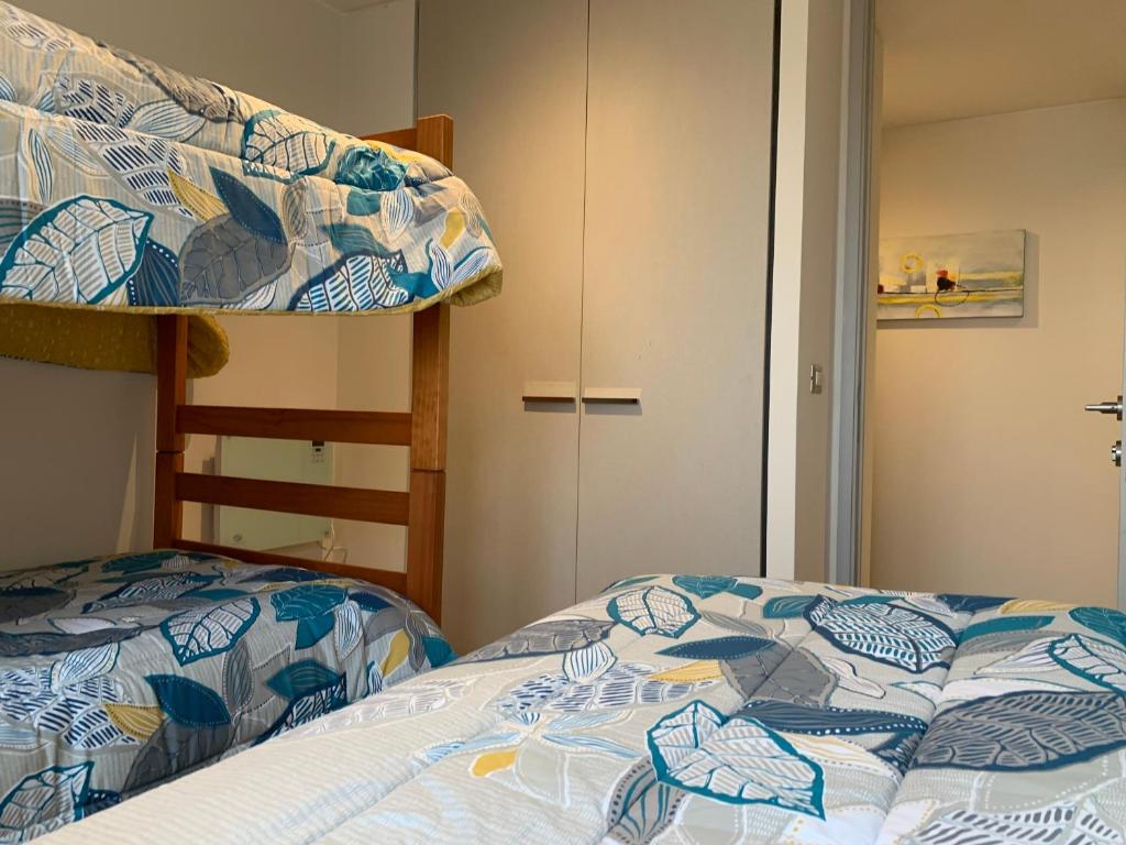 Postel nebo postele na pokoji v ubytování Tantum Concon Apartment