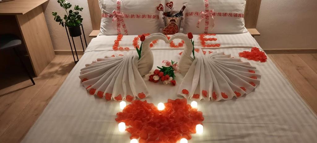 Postel nebo postele na pokoji v ubytování Hotel Dunavis
