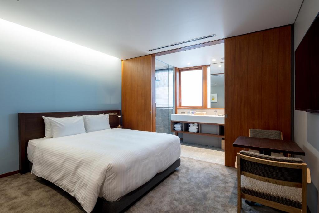 Postel nebo postele na pokoji v ubytování HOTEL AO KAMAKURA
