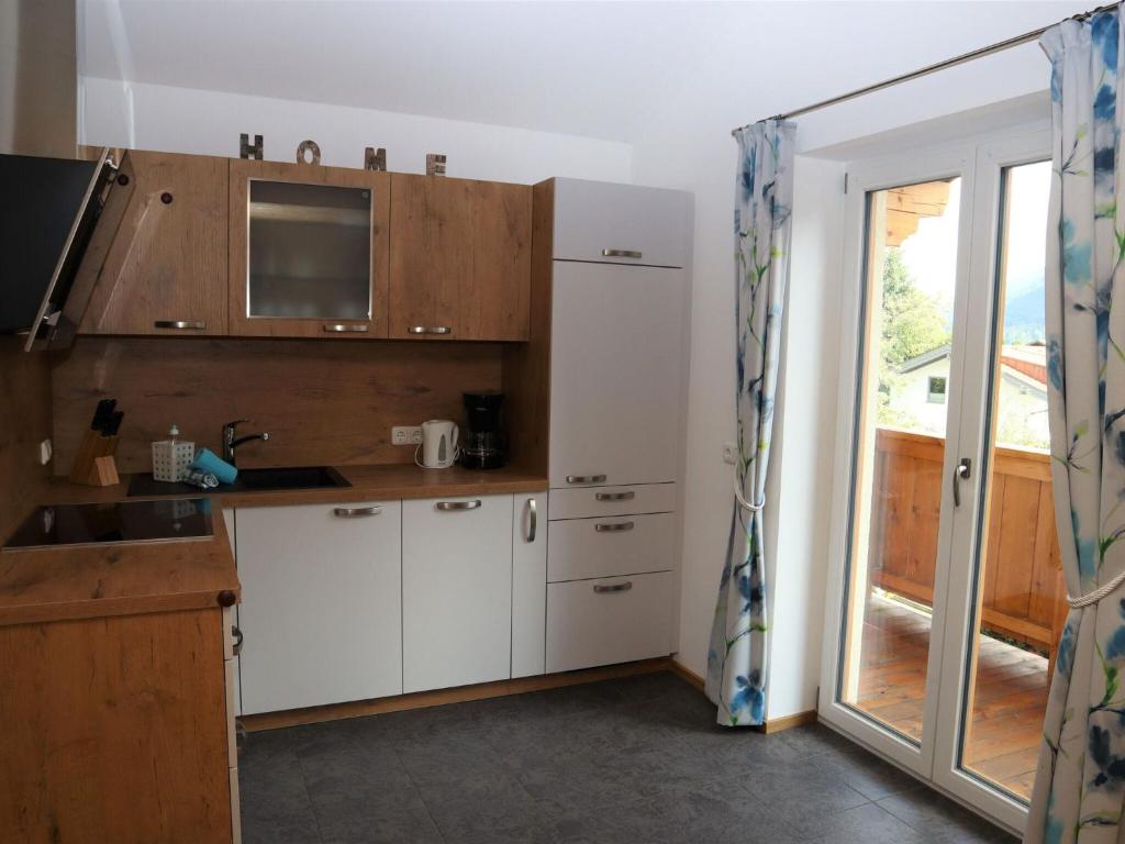 A kitchen or kitchenette at Apartment in Bramberg am Wildkogel with balcony