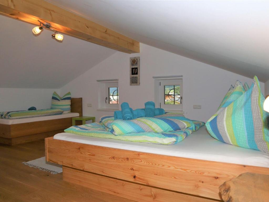 A bed or beds in a room at Apartment in Bramberg am Wildkogel with balcony