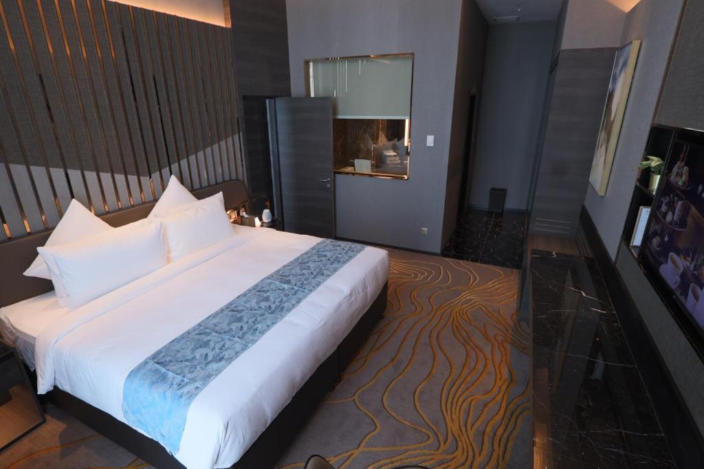 Postel nebo postele na pokoji v ubytování Ames Hotel