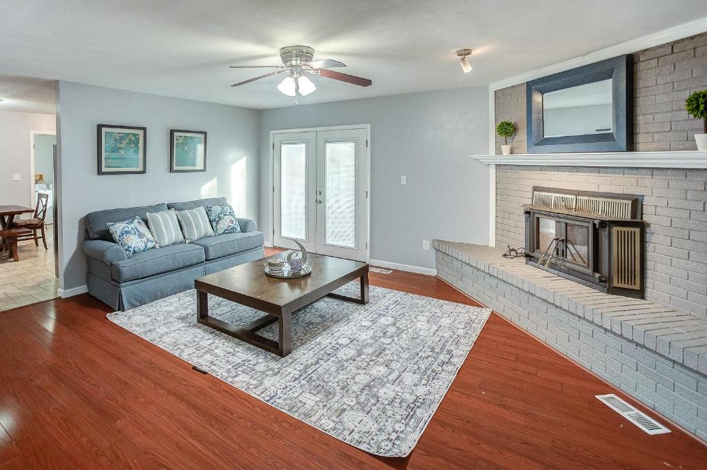a living room with a couch and a fireplace at Belleville Beauty - Luxury Stay for Work or stay for Play either way this is the perfect property for you! residence in Belleville