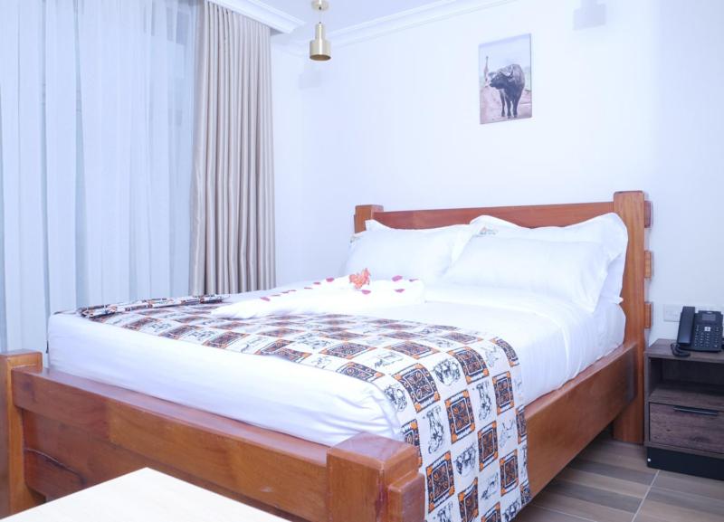Postel nebo postele na pokoji v ubytování Pori City Hotel