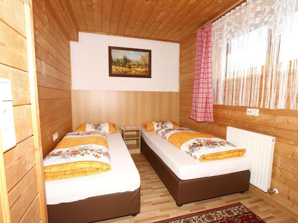 A bed or beds in a room at Apartment in Mayrhofen in the mountains